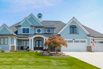 luxury house with blue siding
